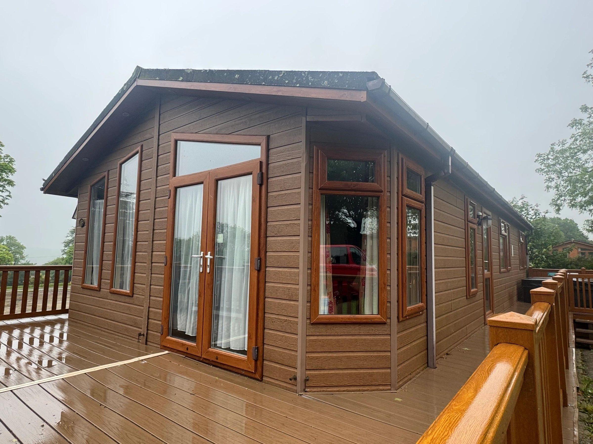 The Omar Heron residential lodge with wrap-around decking at the showground